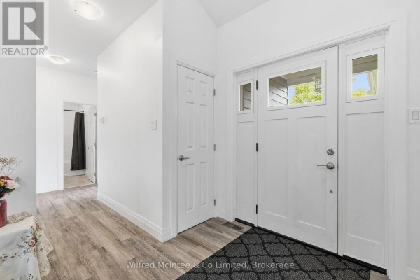 Modern front door with windows and wood-look flooring - 316040 6 Highway Chatsworth