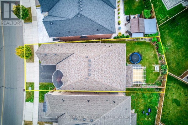 Aerial view of the property showing the house, backyard, and adjacent properties. - 3164 Post Road, Oakville