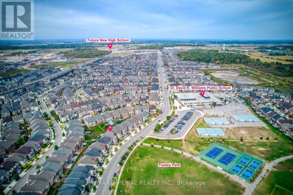 Aerial view of the Oakville neighborhood showing houses, streets, a park, and schools. - 3164 Post Road, Oakville