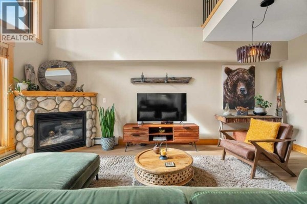 Living room - 317, 175 Crossbow, Canmore, AB T1W3H7 Photo 4