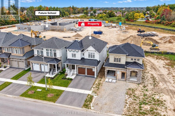 Aerial view of a newly constructed house on Orion Boulevard, showing surrounding homes and development. - 3183 Orion Boulevard, Orillia