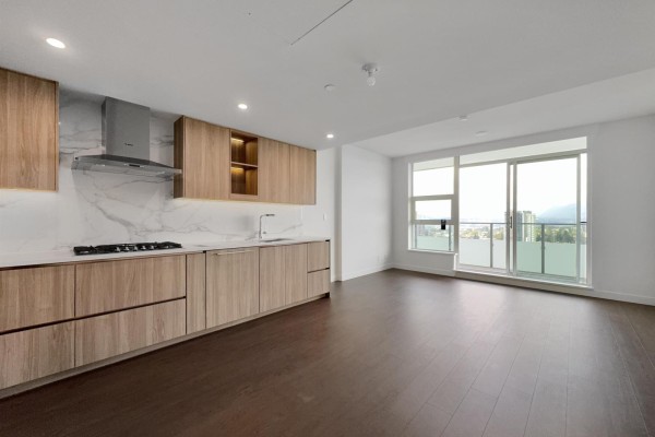 Open concept living area with a modern kitchen and large windows with a view. - 31xx 13778 100 Avenue, Surrey