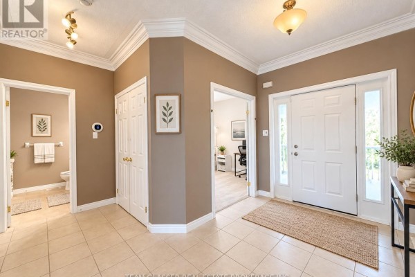 Interior foyer with beige walls, tile floors, and doorways to other rooms. - 32 - 44 Edgevalley Road, London East