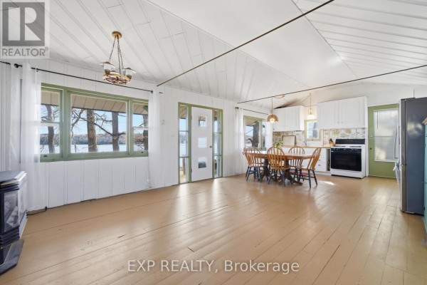 Kitchen and dining area with lake view - 32 Quinte View Road Greater Napanee