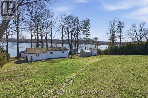Waterfront cottage with outbuildings and trees - 32 Quinte View Road Greater Napanee