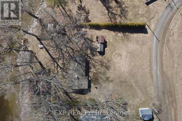 Aerial view of property with trees, sheds, and driveway - 32 Quinte View Road Greater Napanee
