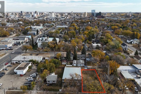 Aerial view similar to the first, highlighting the lot's location amidst urban development. - 320 K Avenue S, Saskatoon