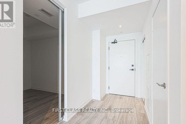 Hallway with apartment entrance door and closet. - 3215 - 55 Mercer Street, Toronto