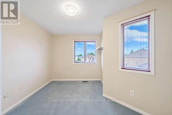 Bedroom with two windows and blinds - 3242 Tortola Court Mississauga