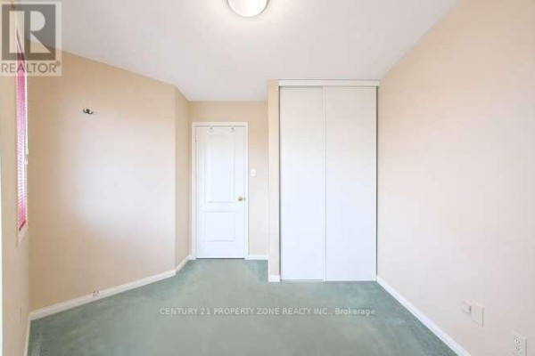 Bedroom with sliding closet, door, and window - 3242 Tortola Court Mississauga