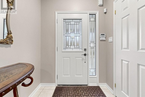 Entranceway of a residential home with a white door and side windows. - 325 Isaac Murray Avenue, Vaughan