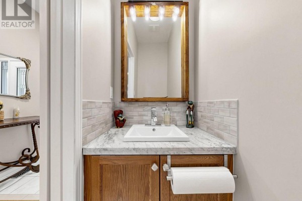 Entryway with light beige walls, white doors, and decorative console table. - 325 Isaac Murray Avenue, Vaughan