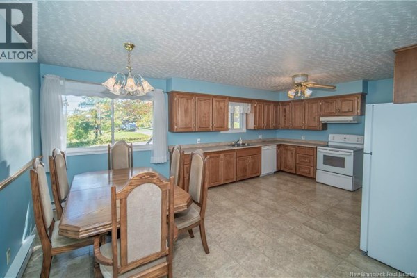 View of kitchen, dining area, and window overlooking the outdoors. - 3259 Route 148, Nashwaak Bridge
