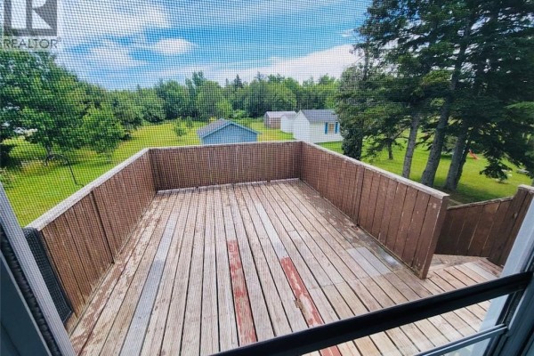 Exterior of a white, two-story house with a central entrance and windows on both levels. - 326 1ere Rue, Shippagan
