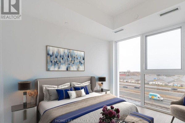 Modern bathroom with a single vanity, toilet, and glass-enclosed shower. - 327 - 36 Zorra Street, Toronto