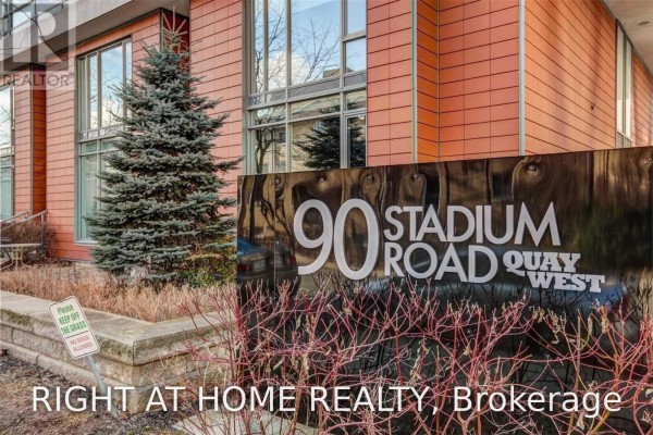 Building exterior detail with a "90 Stadium Road" sign. - 328 - 90 Stadium Road, Toronto