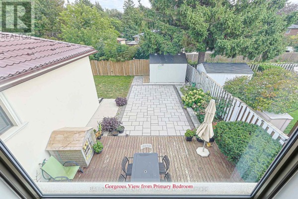 Backyard with deck, patio, sheds, and trees - 33 Deerford Road Toronto