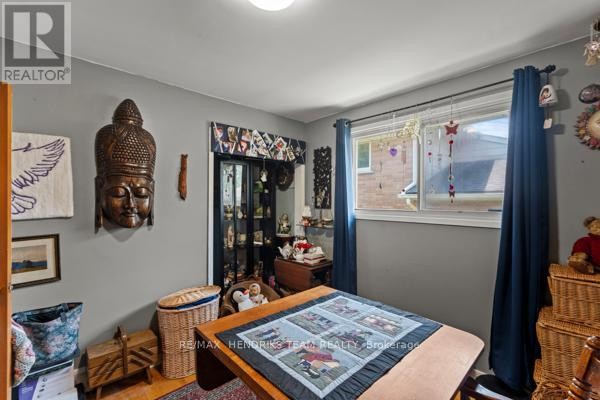 Buddha head decor, display cabinet, and quilted table - 33 Meadowbrook Crescent St Catharines