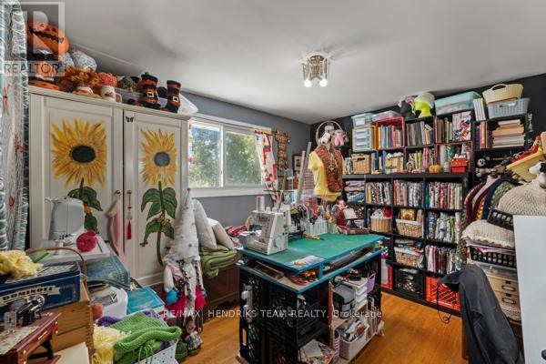 Crafting room with sewing machine, mannequin, and full bookshelves - 33 Meadowbrook Crescent St  Catharines
