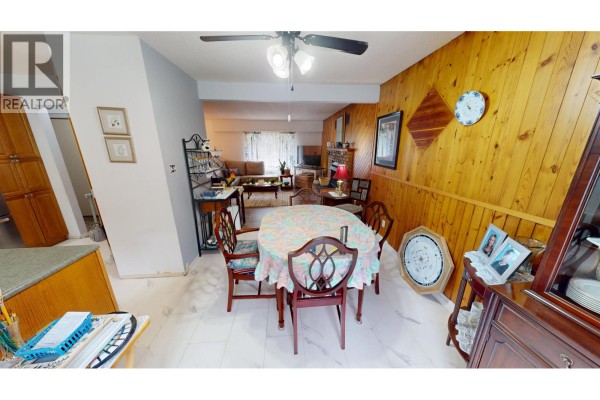 View from the dining area looking into the living room and a hallway. - 330 Caragana Road, Quesnel