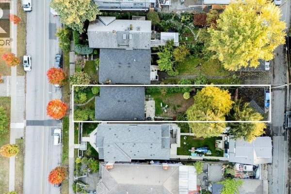 Overhead aerial view of 3315 Victoria Drive, showing the house, its backyard, and neighboring properties on both sides. - 3315 Victoria Drive, Vancouver