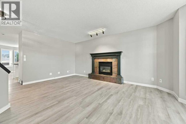 Living room - 334 Bridlewood Court Sw, Calgary, AB T2Y3T6 Photo 4