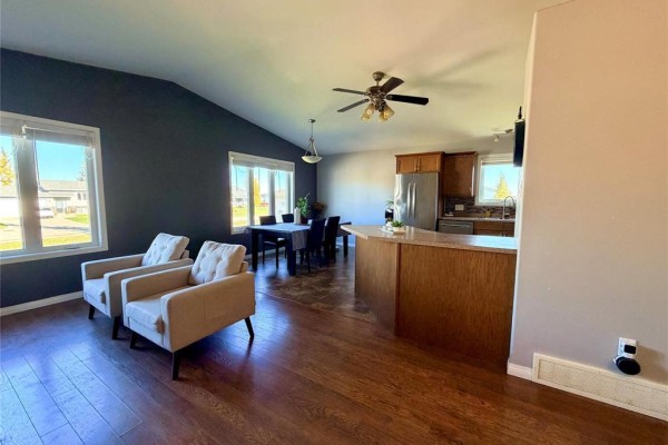 A kitchen with light oak cabinets, stainless steel appliances including a dishwasher, oven, and microwave. - 335 6th Avenue, Oakville