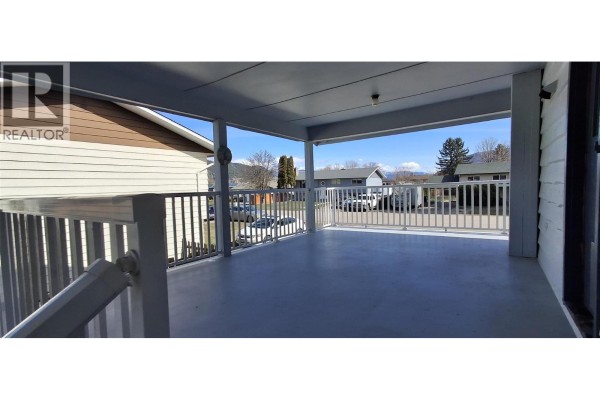 Bedroom with light wood laminate flooring, a large window, and an open closet with shelving. - 338 Beach Drive, Chase