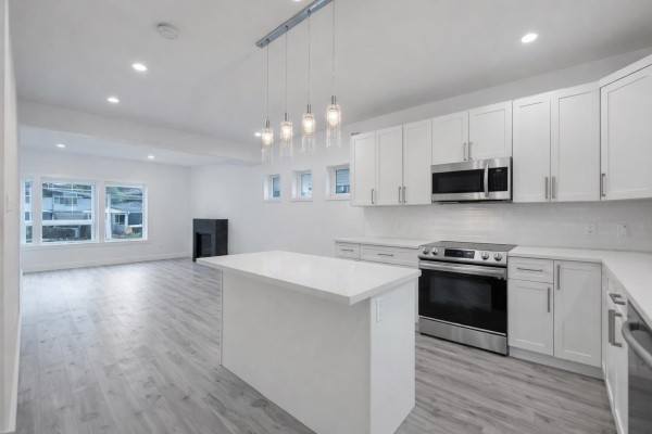Functional kitchen layout with ample storage and natural light from windows - 34 750 Hot Springs Road, Harrison Hot Springs, Harrison Hot Springs