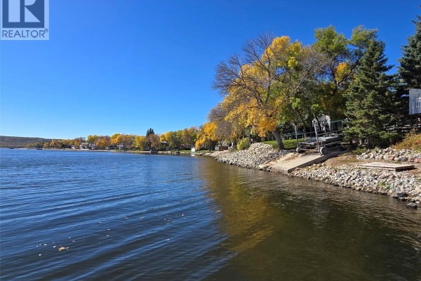 View of Crooked Lake with colorful autumn trees lining the shore and a boat launch. - 34 Bear Road, Crooked Lake