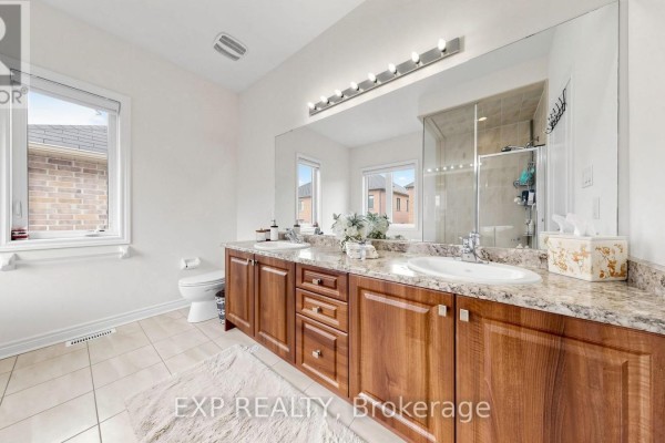 Dual-sink bathroom with granite counters and glass shower - 34 Buttonleaf Crescent Whitchurch Stouffville