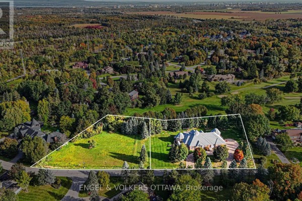Aerial view of two adjacent properties outlined in white, one a grassy lot and the other a property with a house. - 34 Cedarhill Drive, Ottawa