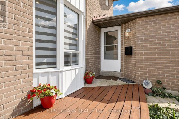 Close-up of the front door and porch area of a brick house. - 34 Mayberry Court, Brampton