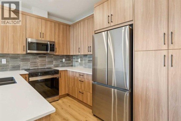 Living room - 3403, 3700 Seton Avenue Se, Calgary, AB T3M4K4 Photo 3