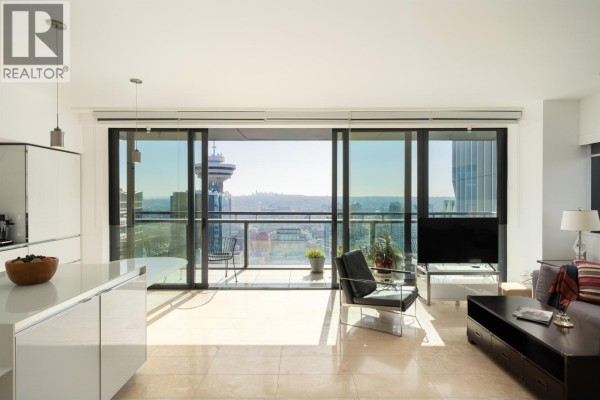 Spacious living area featuring a balcony with city views through floor-to-ceiling windows. - 3403 838 W Hastings Street, Vancouver