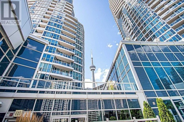 Aerial view of an airport runway and islands across a large body of water. - 3409 - 208 Queens Quay W, Toronto