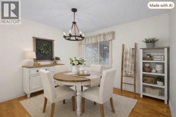 Living room with a sofa, coffee table, side tables, and curtains. - 3414 Morley Trail Nw, Calgary