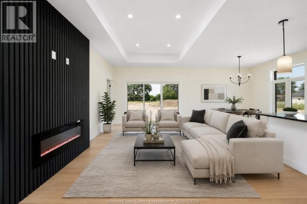 3D floor plan showing open layout with living areas, kitchen, and two garages. - 3445 Tullio Drive, Lasalle