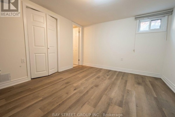 Compact kitchen with white cabinetry, stainless steel appliances, and tile flooring - 345 Centre Street E, Richmond Hill