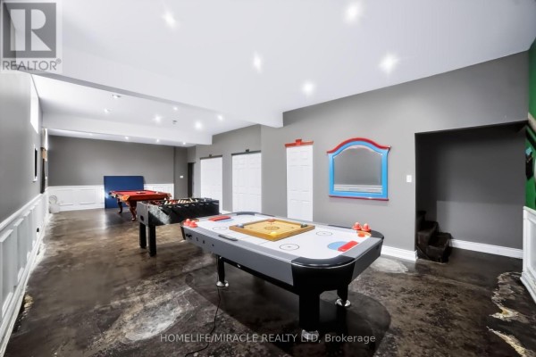 Recreation room with air hockey, foosball, and pool tables - 345305 15th Side Road Amaranth