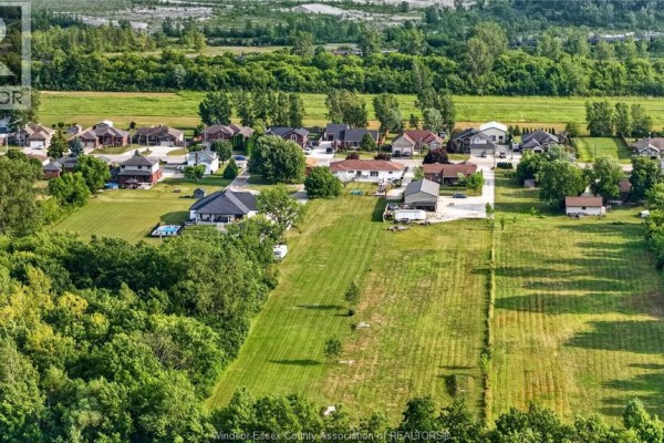 Aerial view of houses and large green lots with a pool - 346 Texas Road Amherstburg