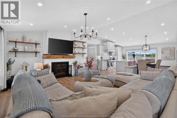 Living room with fireplace and open-concept kitchen - 346 Texas Road Amherstburg
