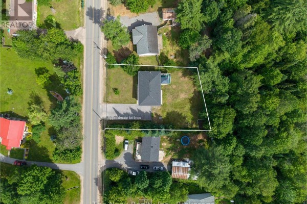 Aerial view of the property at 348 Chemaushgon Road, showing the house and surrounding area. - 348 Chemaushgon Road, Bancroft
