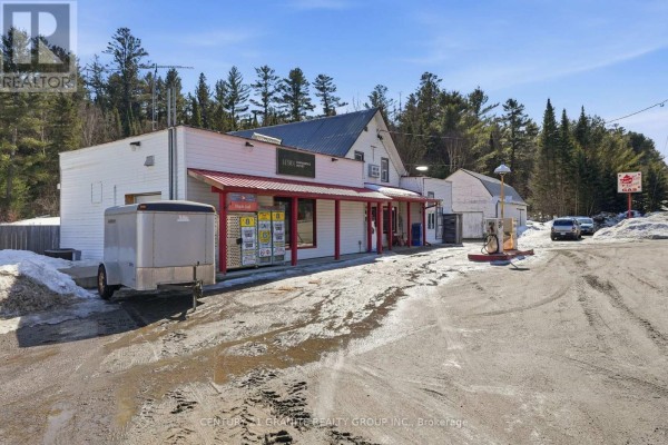 Rear view of building showing additional structures and snowy landscape. - 34820 Ab Hwy 62 Highway, Hastings Highlands