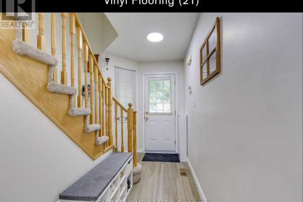 Interior entryway with staircase, bench, and door to the outside. - 35 - 5260 Mcfarren Boulevard, Mississauga