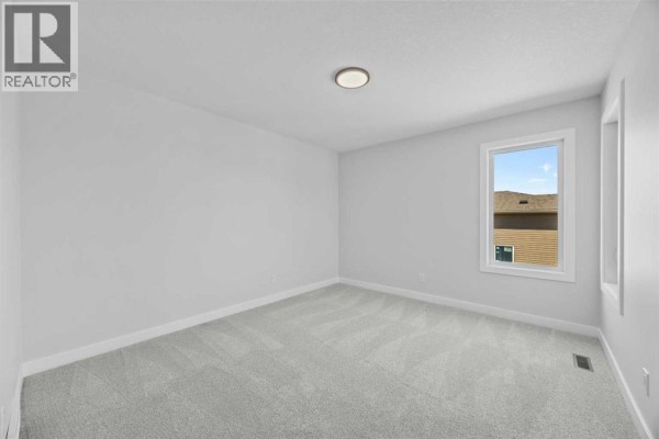 Living room - 35 Creekside Rise Sw, Calgary, AB T3X5V9 Photo 5