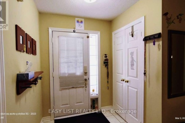 Bathroom with light blue walls, white fixtures, and organized shelving - 35 Raquel Street, Barrie