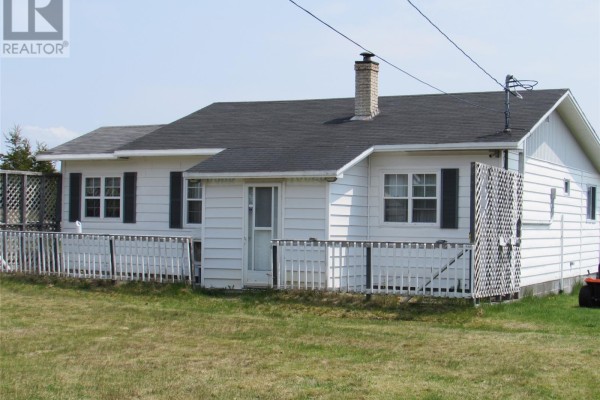 Close-up of white bungalow exterior with white railings and lattice panels. - 35 Ryan's Hill, Colliers