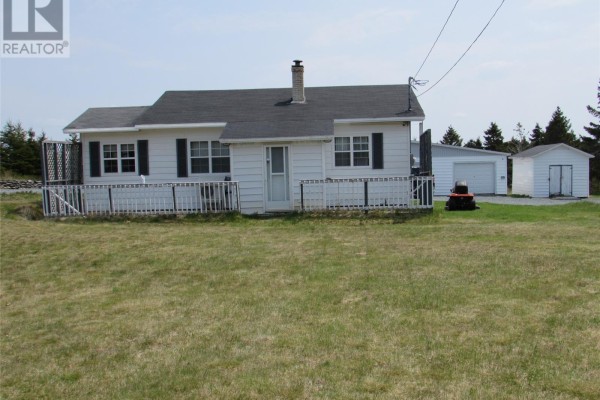 Exterior of bungalow with a detached garage and shed on a sunny day. - 35 Ryan's Hill, Colliers