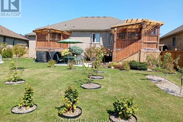 Backyard with hot tub, deck, patio furniture, and lawn - 35 Tanya Drive Southwest Middlesex